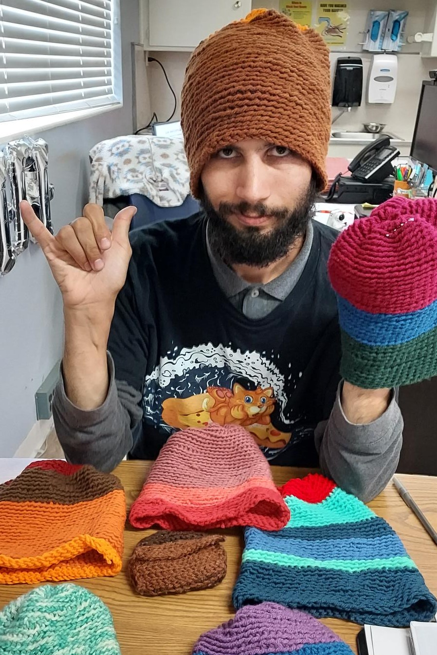 posing with handmade beanies